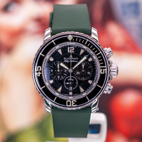 Blancpain Fifty Fathoms Flyback 5085F-1130-71S pictured on a green strap, with black chronograph dial and steel case