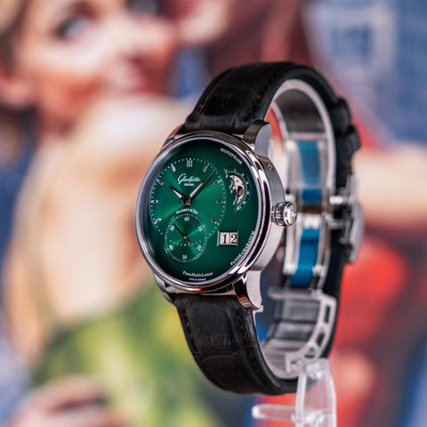 Glashütte Original Panomaticlunar Green watch With pucks and timepieces 